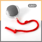 Pelota gris con cuerda roja
